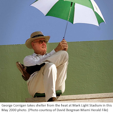 George Corrigan takes shelter from the heat at Mark Light Stadium in this May 2000 file photo. (Photo courtesy of David Bergman Miami Herald File)